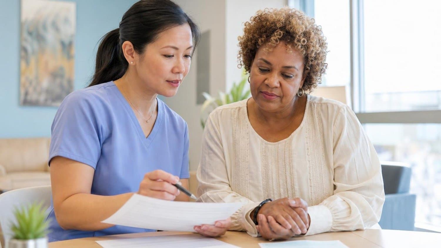 A nurse explaining paperwork to a patient