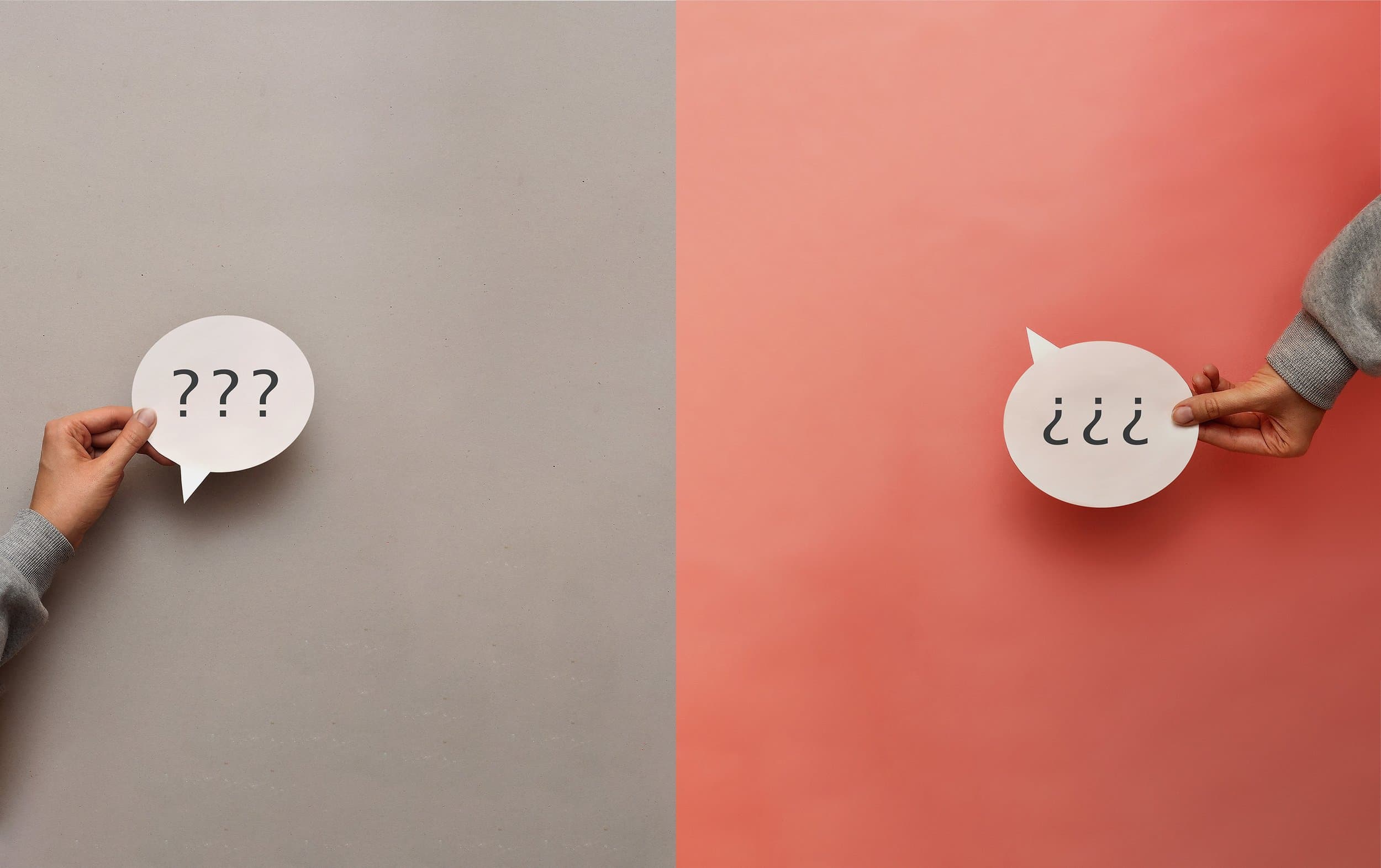 Hands holding speech bubbles with question marks and an information symbol