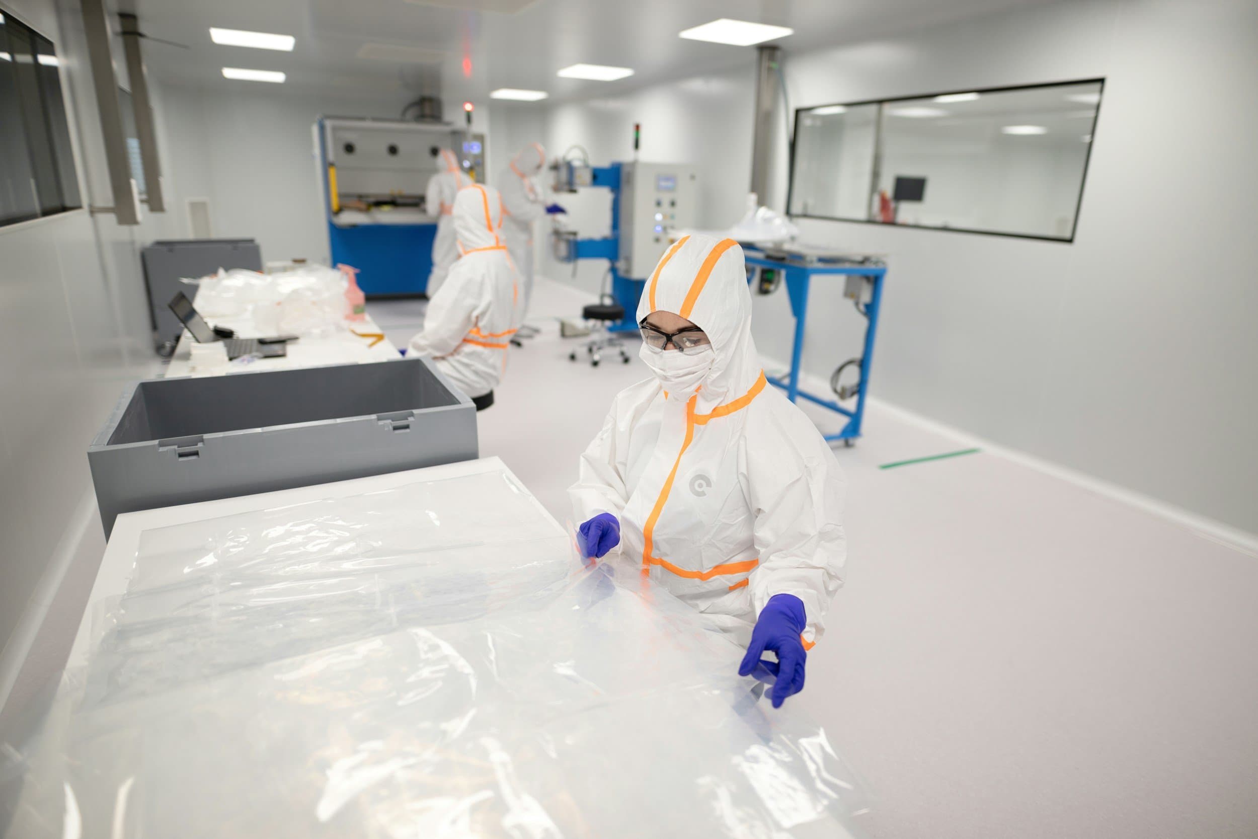Workers on an industrial production floor