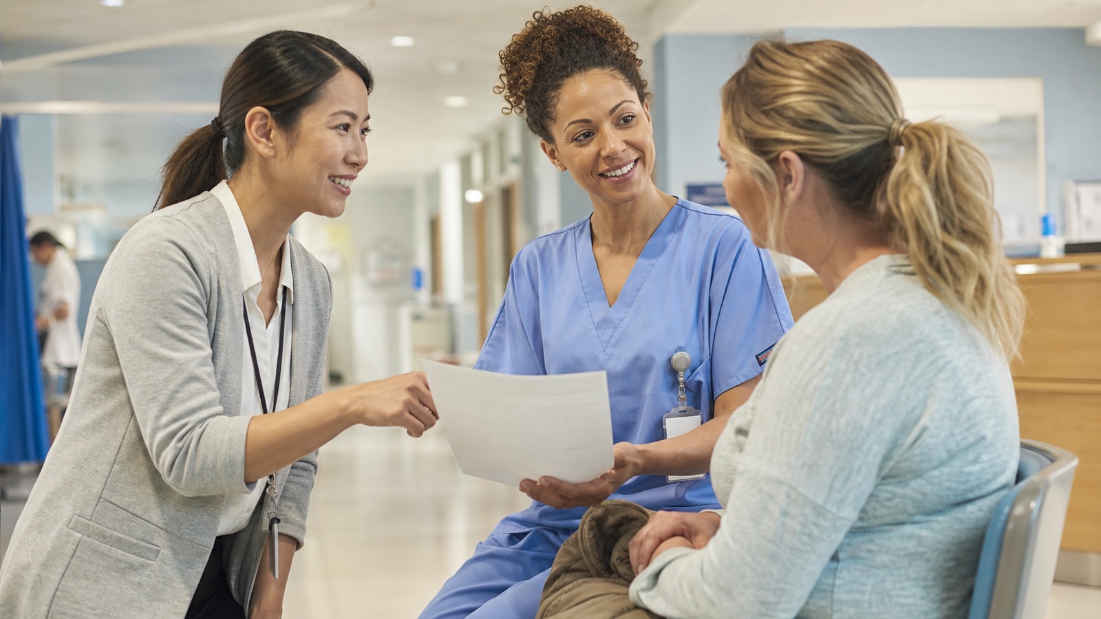 Interpreter helping a nurse review discharge instructions with a patient before leaving an Indiana emergency department
