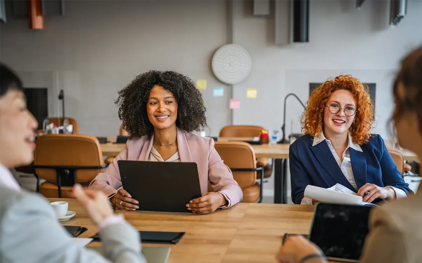 Two confident HR professionals win handling Haitian Creole in the organization.