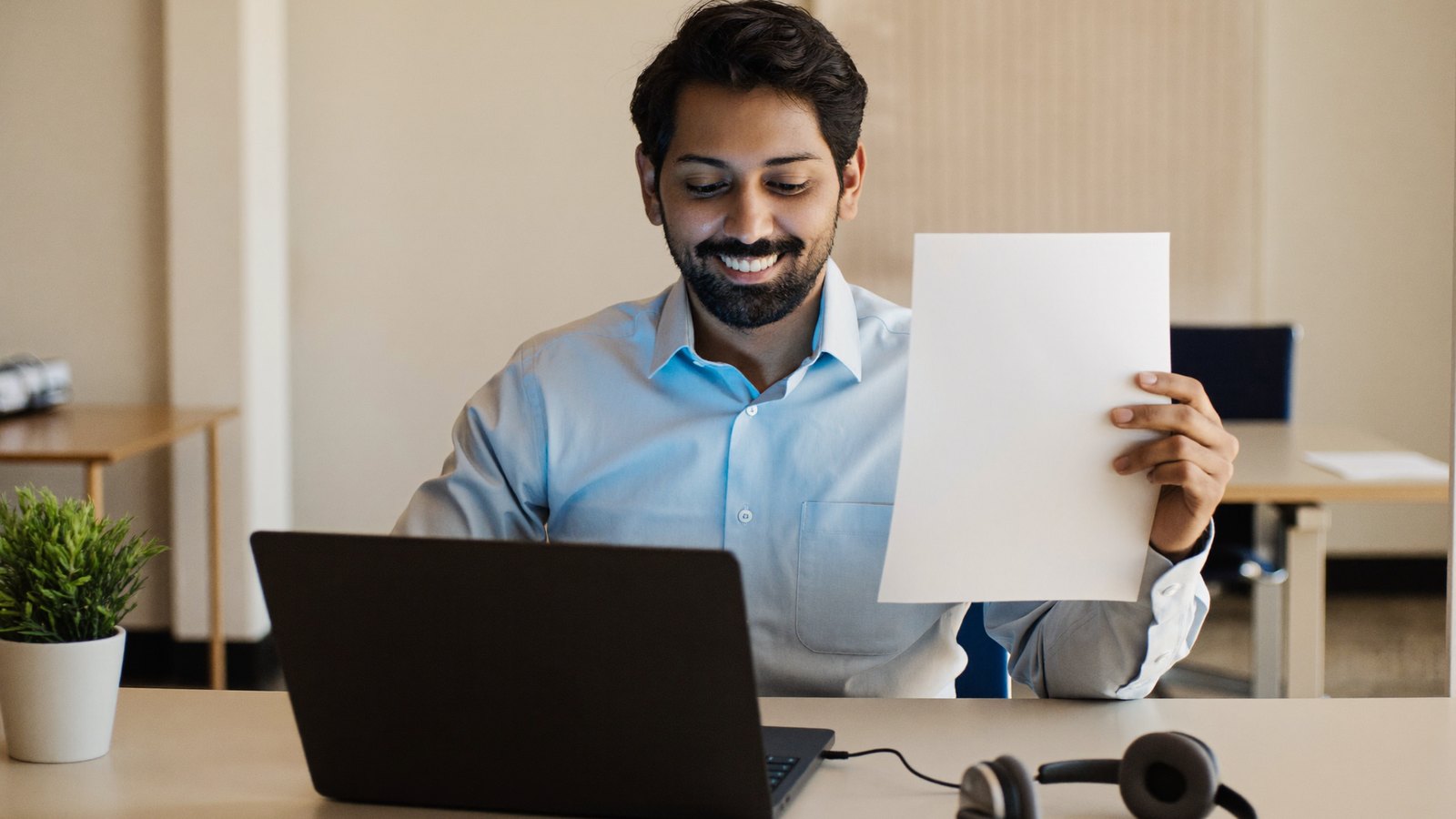 Translator comparing an insurance denial letter with its translation at a desk